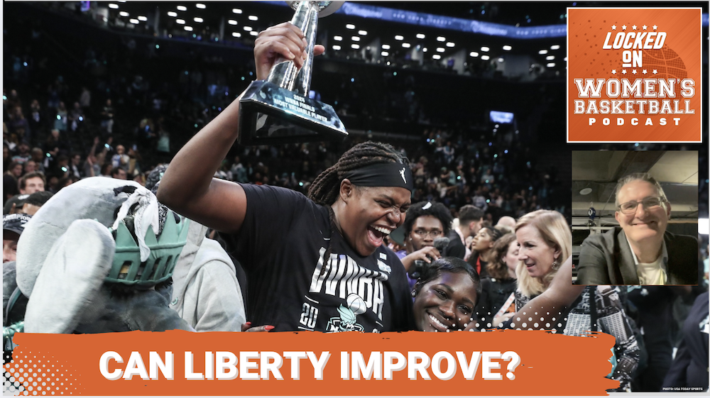 Jonquel Jones holds up a trophy while celebrating with her team